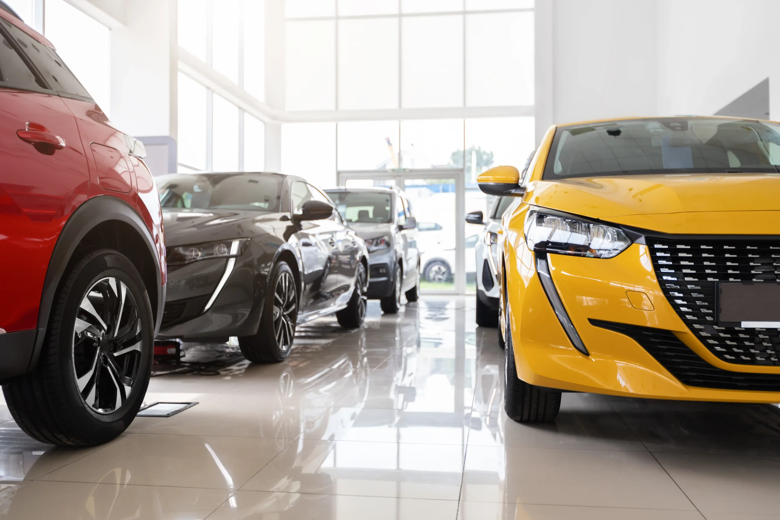 Social media setup for car dealerships showing a modern automotive showroom